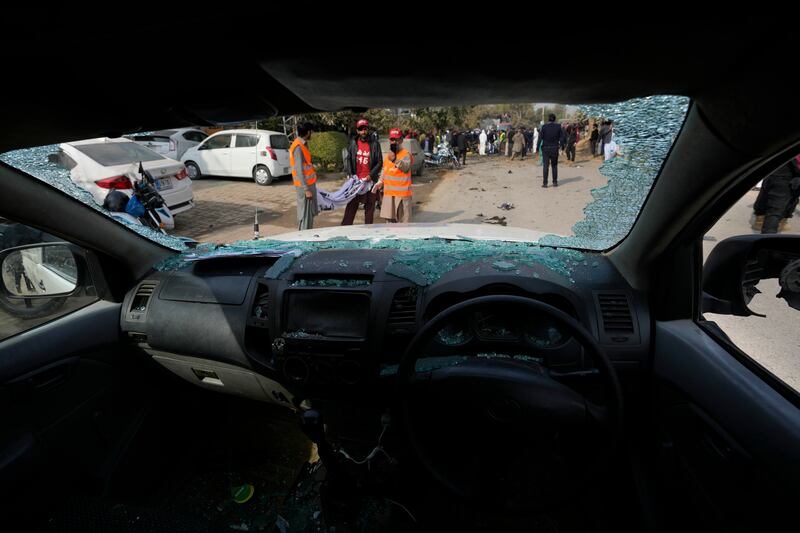 Rescue workers at the scene. AP Photo