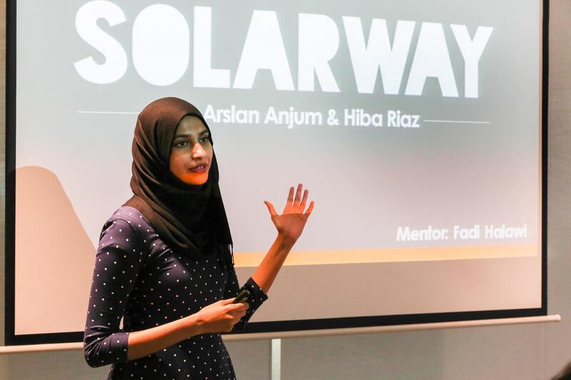 The Masdar Institute team presents their project SolarWay. Courtesy APCO Worldwide