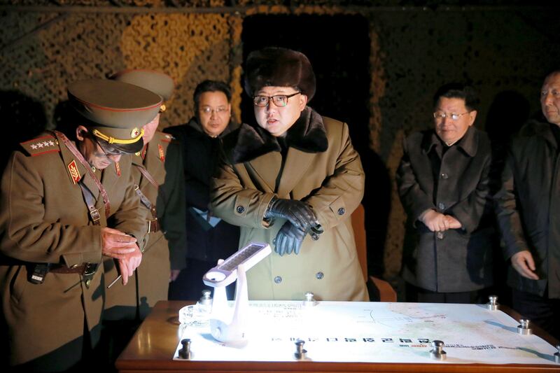 FILE PHOTO: North Korean leader Kim Jong Un talks with officials at the ballistic rocket launch drill of the Strategic Force of the Korean People's Army (KPA) at an unknown location, in this undated photo released by North Korea's Korean Central News Agency (KCNA) in Pyongyang on March 11, 2016.        REUTERS/KCNA/File Pix      ATTENTION EDITORS - THIS PICTURE WAS PROVIDED BY A THIRD PARTY. REUTERS IS UNABLE TO INDEPENDENTLY VERIFY THE AUTHENTICITY, CONTENT, LOCATION OR DATE OF THIS IMAGE. FOR EDITORIAL USE ONLY. NOT FOR SALE FOR MARKETING OR ADVERTISING CAMPAIGNS. NO THIRD PARTY SALES. NOT FOR USE BY REUTERS THIRD PARTY DISTRIBUTORS. SOUTH KOREA OUT. NO COMMERCIAL OR EDITORIAL SALES IN SOUTH KOREA. THIS PICTURE IS DISTRIBUTED EXACTLY AS RECEIVED BY REUTERS, AS A SERVICE TO CLIENTS