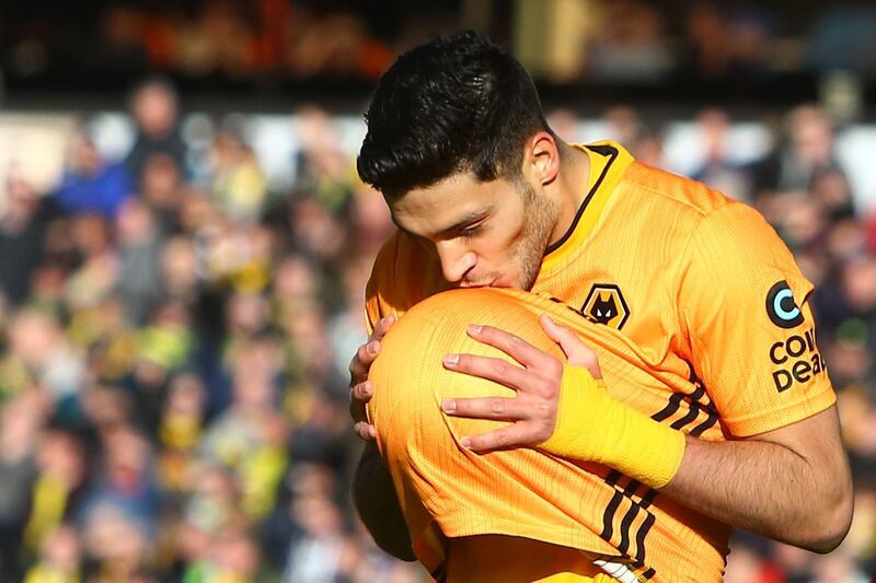 Wolverhampton Wanderers' Mexican striker Raul Jimenez celebrates scoring their third goal during the English Premier League football match between Wolverhampton Wanderers and Norwich City at the Molineux stadium in Wolverhampton, central England  on February 23, 2020. RESTRICTED TO EDITORIAL USE. No use with unauthorized audio, video, data, fixture lists, club/league logos or 'live' services. Online in-match use limited to 120 images. An additional 40 images may be used in extra time. No video emulation. Social media in-match use limited to 120 images. An additional 40 images may be used in extra time. No use in betting publications, games or single club/league/player publications.
 / AFP / GEOFF CADDICK / RESTRICTED TO EDITORIAL USE. No use with unauthorized audio, video, data, fixture lists, club/league logos or 'live' services. Online in-match use limited to 120 images. An additional 40 images may be used in extra time. No video emulation. Social media in-match use limited to 120 images. An additional 40 images may be used in extra time. No use in betting publications, games or single club/league/player publications.
