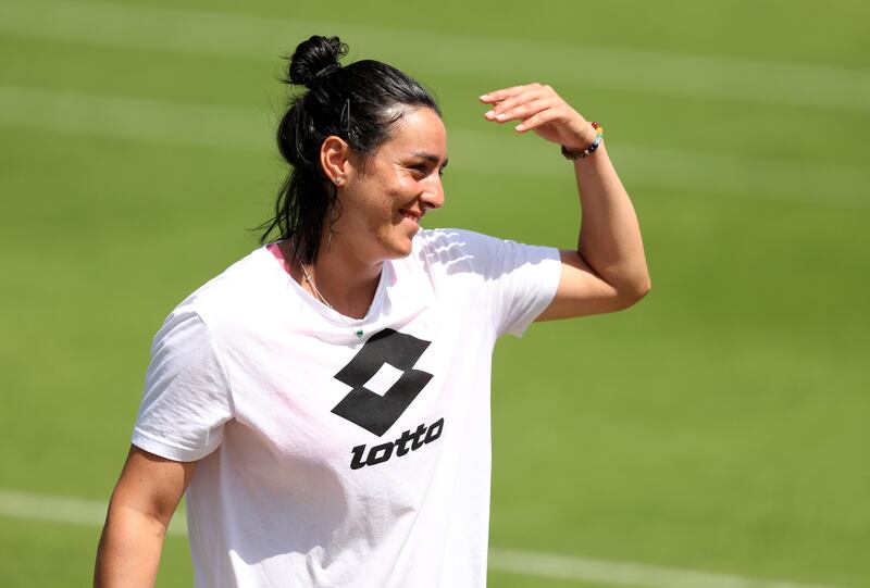 Ons Jabeur smiles during a training session. The Tunisian is the first Arab to reach a Grand Slam singles final. Getty Images