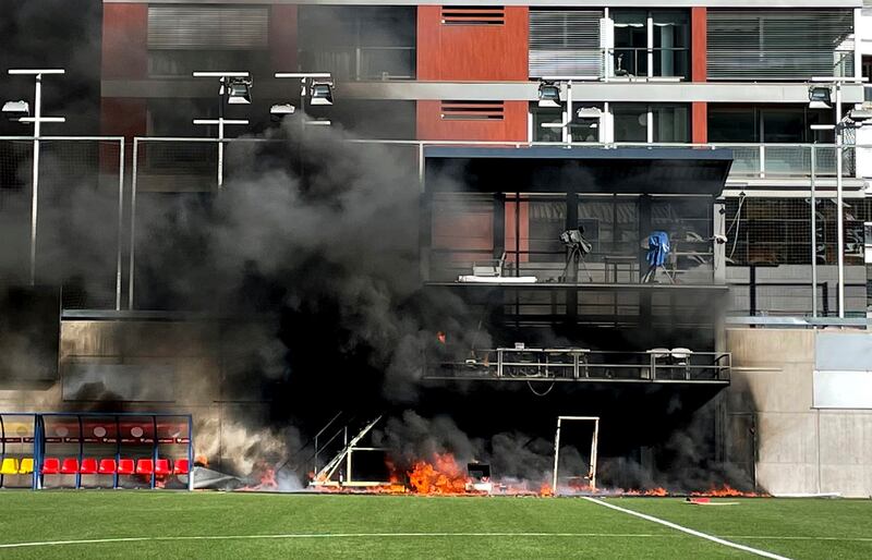 A fire burns structures at the national stadium in Andorra's capital. Photo: AP