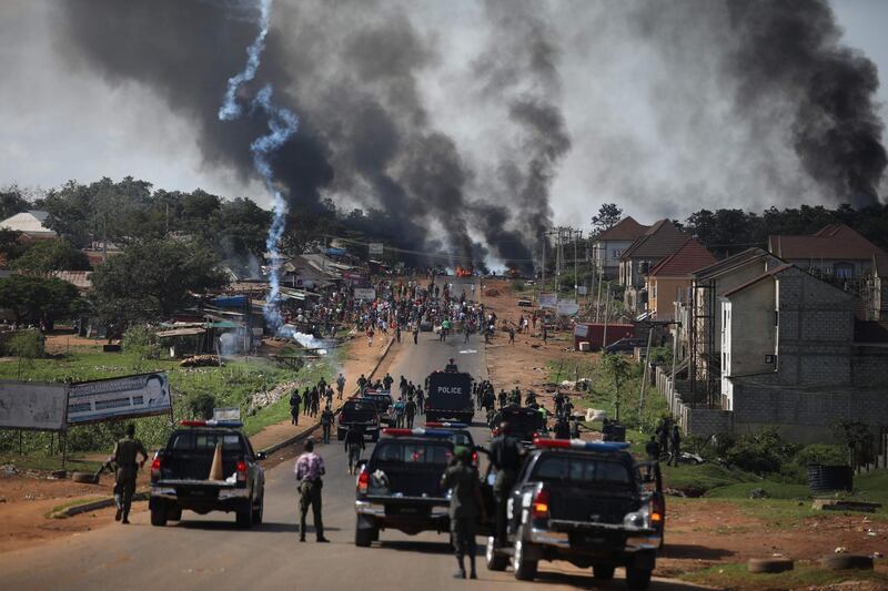 Nigerian Police fire teargas at people during clashes between youths in Apo, Abuja, Nigeria following the ongoing demonstrations against the unjustly brutality of the Nigerian Police Force Unit, the Special Anti-Robbery Squad (SARS).  AFP