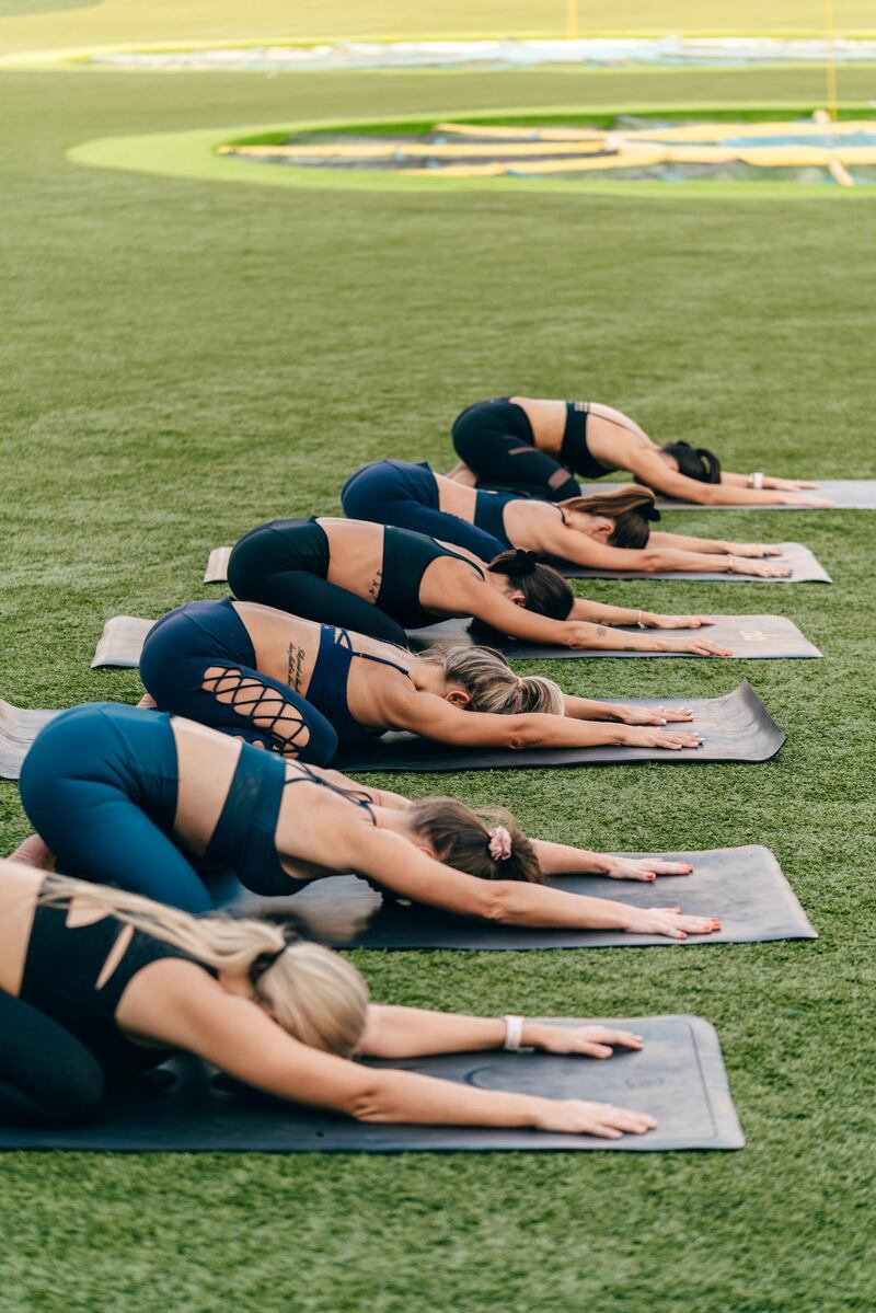 Participants can enjoy a weekly morning yoga session followed by light bites at Topgolf. Courtesy Topgolf