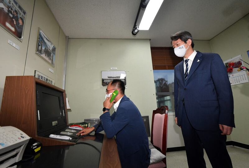 In this photo taken on September 16, 2020, South Korean Unification Minister Lee In-young looks at the inter-Korean hotline during a visit to the south side of the truce village of Panmunjom in the Demilitarised Zone dividing the two Koreas.