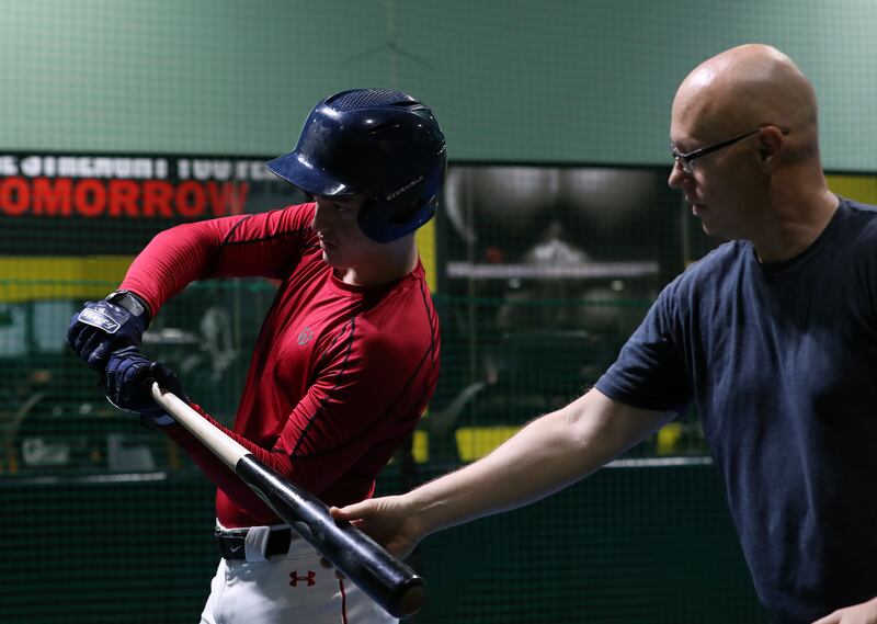 The father and son duo work on batting technique. Chris Whiteoak/The National