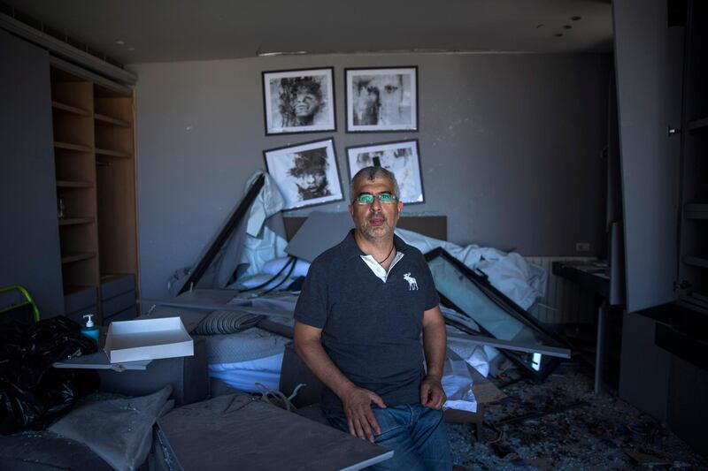 Karim Corbani, 45, poses for a portrait inside his bedroom in Beirut. Getty Images