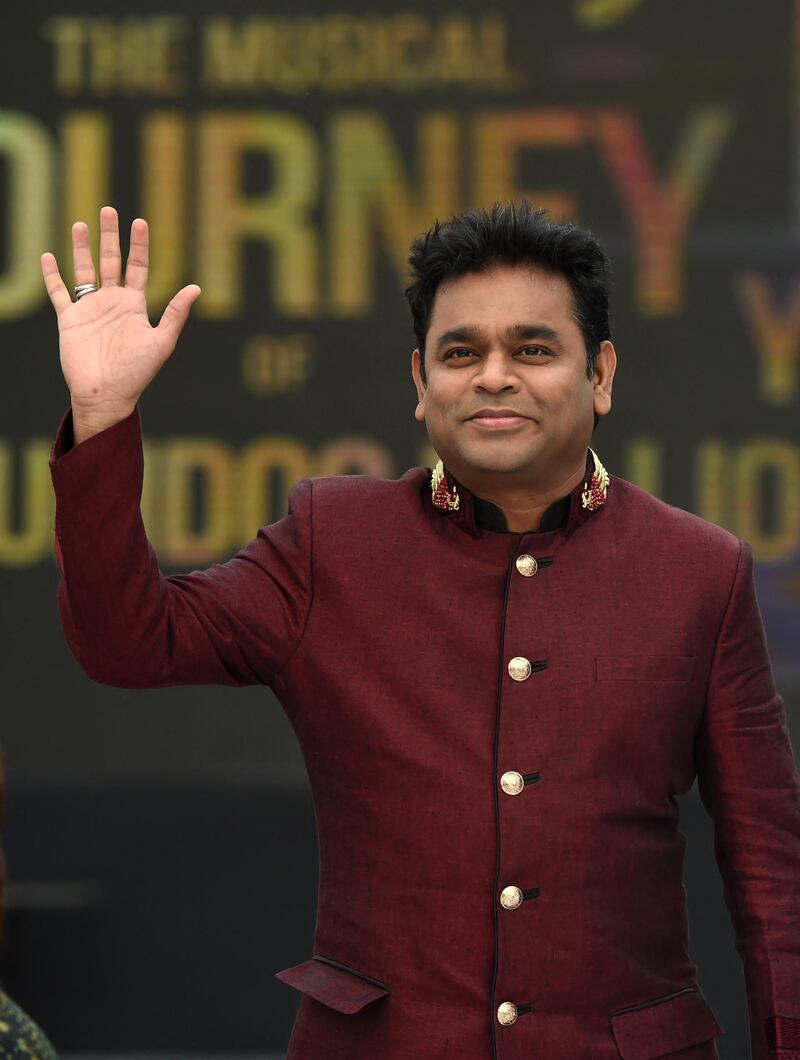 Indian music director AR Rahman waves at fans during an event to celebrate ten years since winning the Oscar award for Best Original Score in 2009 for the film 'Slumdog Millionaire', in Mumbai on February 4, 2019. - Slumdog Millionaire won eight Oscars including best picture at the 81st Academy Awards in 2009. (Photo by Punit PARANJPE / AFP)