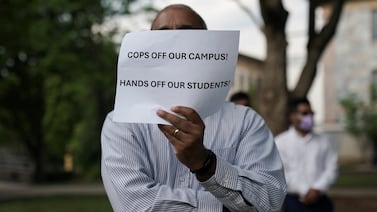 A man holds during a demonstration at Emory University in support of Palestinians, in Atlanta, Georgia. Reuters