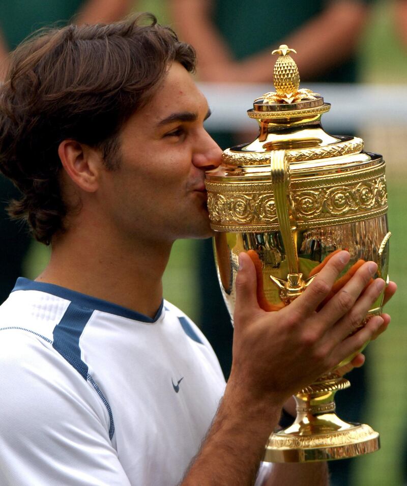 Roger Federer with the 2005 Wimbledon Trophy. PA