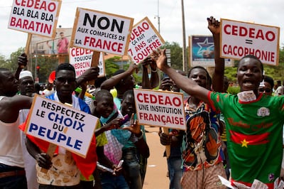 Supporters of Ibrahim Traore protest against France and the West African regional bloc known as ECOWAS in the streets of Ouagadougou. AP