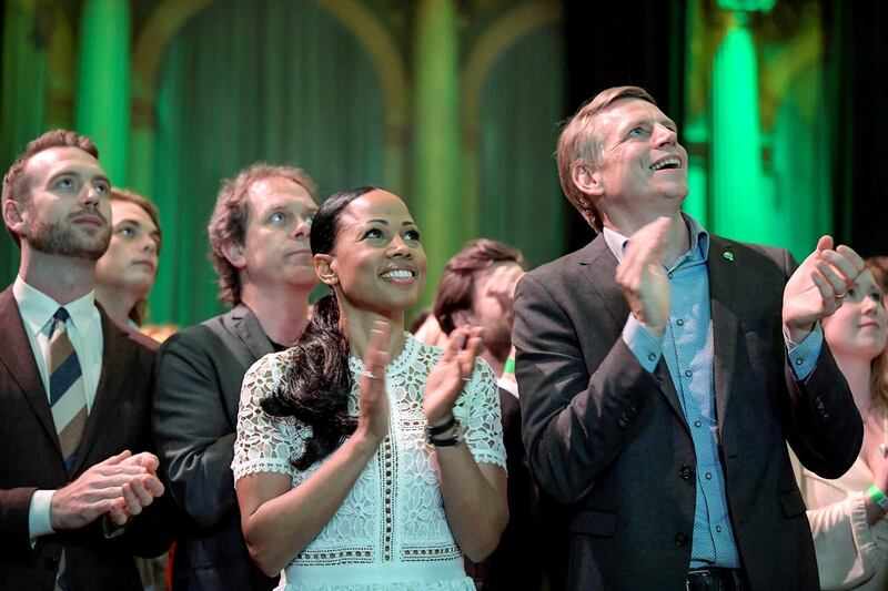 Swedish Green Party candidate Alice Bah Kuhnke and Per Bolund, Minister for Financial Markets and Housing, applaud at the party's election night watch party. Reuters