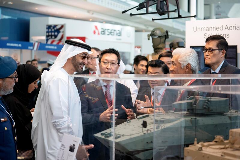 ABU DHABI, UNITED ARAB EMIRATES - February 20, 2019: HH Sheikh Mohamed bin Zayed Al Nahyan, Crown Prince of Abu Dhabi and Deputy Supreme Commander of the UAE Armed Forces (3rd L) visits ST Engineering stand, during the 2019 International Defence Exhibition and Conference (IDEX), at Abu Dhabi National Exhibition Centre (ADNEC). Seen with HE Major General Essa Saif Al Mazrouei, Deputy Chief of Staff of the UAE Armed Forces (L).
( Ryan Carter for the Ministry of Presidential Affairs )
---