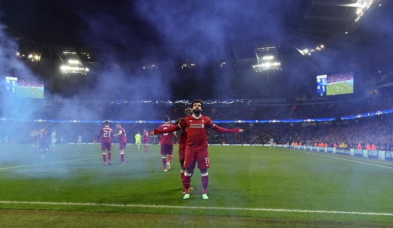 Liverpool's Mohamed Salah celebrates scoring his team's opening goal. Paul Ellis / AFP