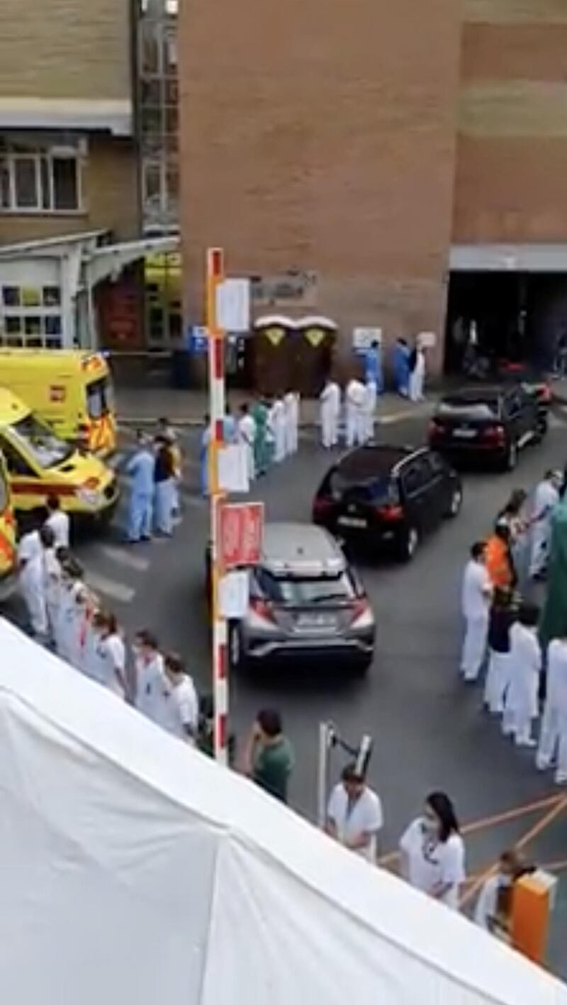 Doctors and nurses turn their back while welcoming Belgium's Prime Minister Sophie Wilmes at Saint-Pierre Hospital, during the coronavirus disease (COVID-19) outbreak, in Brussels, Belgium, May 16, 2020 in this screen grab taken from social media video and obtained by Reuters on May 17, 2020. via REUTERS  NO RESALES. NO ARCHIVES.