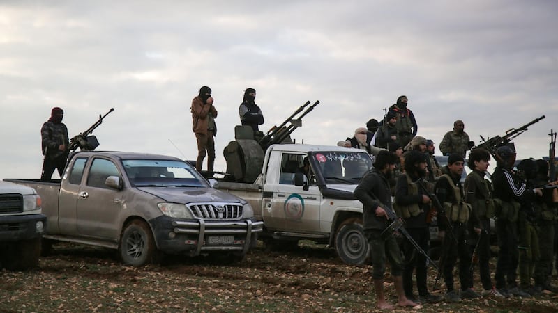 Turkish-backed Syrian fighters gather with their vehicles at a position near the northern Syrian town of Manbij on December 28, 2018.   / AFP / Bakr ALKASEM
