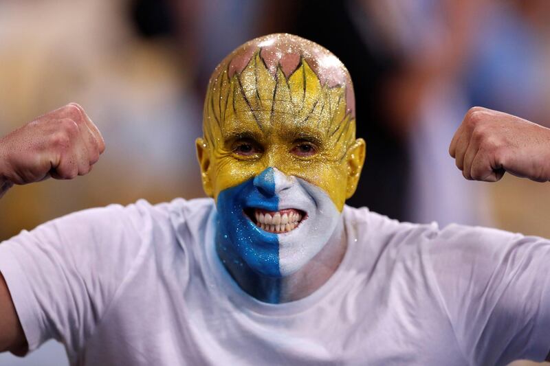 A Uruguayan fan cheers for his team. EPA