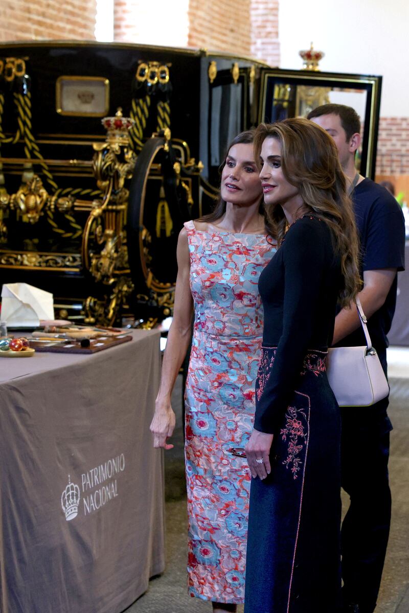 Queen Letizia of Spain and Queen Rania at the National Heritage's workshop in Madrid. Reuters