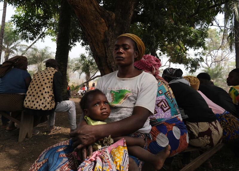 Relatives of the late chief react outside their burnt-out house in Manga, a village in north-eastern Nigeria that lies near the border with Cameroon, weeks after an attack by suspected Cameroonian separatist fighters. The Cameroonian army and the separatists have been engaged in a five-year battle that has displaced thousands of civilians. AFP