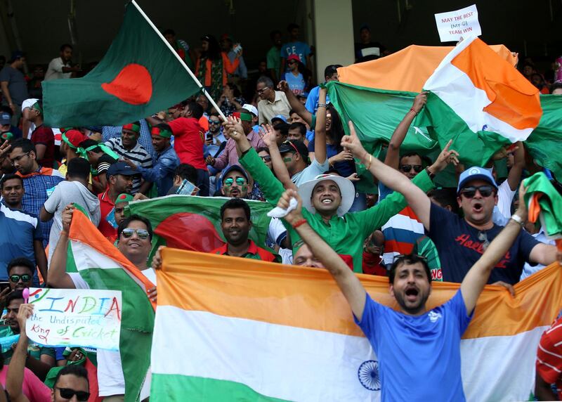Indian and Bangladeshi supporters cheer for their teams before the start of the match. AP Photo