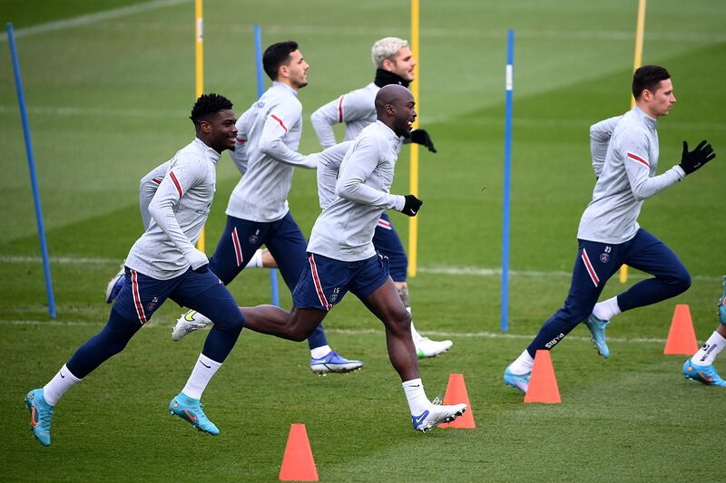 Paris Saint-Germain's Nuno Mendes, Danilo Pereira and  Julian Draxler training with teammates. AFP