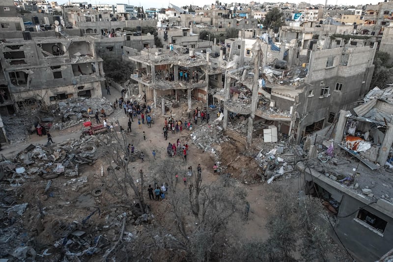 Palestinians inspect the rubble of their destroyed houses after a ceasefire between Israel and Gaza fighters, in Beit Hanun, northern Gaza Strip in Gaza City, Gaza. The ceasefire between Israel and Hamas appeared to be holding, despite fresh clashes at Al-Aqsa Mosque in East Jerusalem. The ceasefire brings to an end eleven days of fighting which killed more than 250 Palestinians, many of them women and children, and 13 Israelis. The conflict began on May 10th after rising tensions in East Jerusalem and clashes at the Al Aqsa Mosque compound. Getty Images