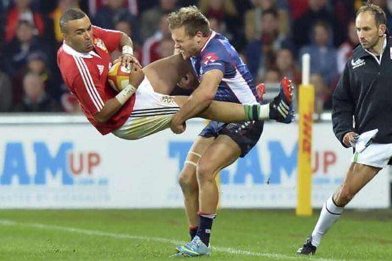 Lachlan Mitchell, right, of the Melbourne Rebels, will miss one match for his uneccessarily rough hit on British & Irish Lions winger Simon Zebo.