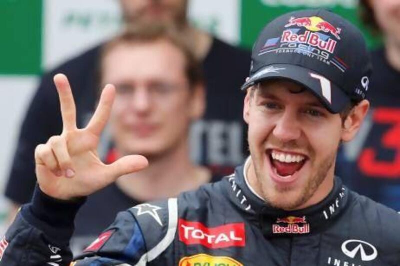 Red Bull Formula One driver Sebastian Vettel, of Germany, celebrates winning the world championship with his team after the Brazilian F1 Grand Prix at Interlagos circuit in Sao Paulo last November. Vettel became Formula One's youngest triple world champion at the age of 25.  Paulo Whitaker / Reuters