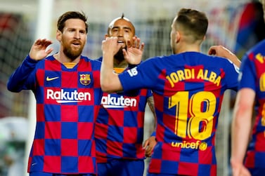Barcelona's Jordi Alba, right, celebrates with Barcelona's Lionel Messi before the goal he scored was disallowed after a VAR decision during a Spanish La Liga soccer match between Barcelona and Real Sociedad at the Camp Nou stadium in Barcelona, Spain, Saturday, March 7, 2020. (AP Photo/Joan Monfort)