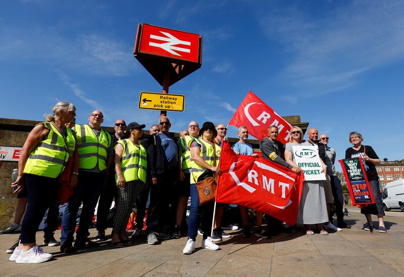 Rail workers picket outside Preston station in northern England. Reuters