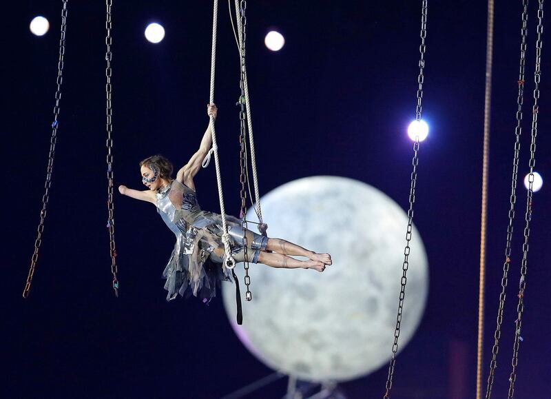 A performer is suspended in midair during the Opening Ceremony for the 2012 Paralympics in London, Wednesday Aug. 29, 2012. (AP Photo/Kirsty Wigglesworth) *** Local Caption ***  London Paralympics Opening Ceremony.JPEG-0734d.jpg