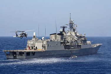 Greek Hydra-class frigate Psara of the Hellenic Navy and a helicopter take part in a military exercise in the eastern Mediterranean Sea, on August 25, 2020. Greek Defence Ministry, AFP