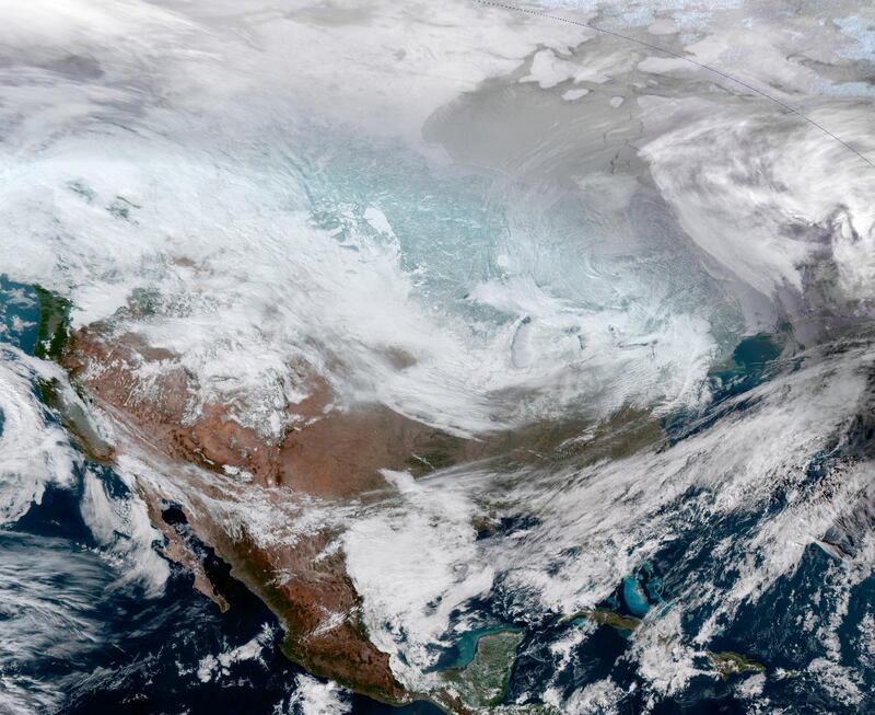 A satellite image of the continental United States shows the extreme cold weather phenomenon called the polar vortex over the Midwest and Great Lakes regions. Reuters