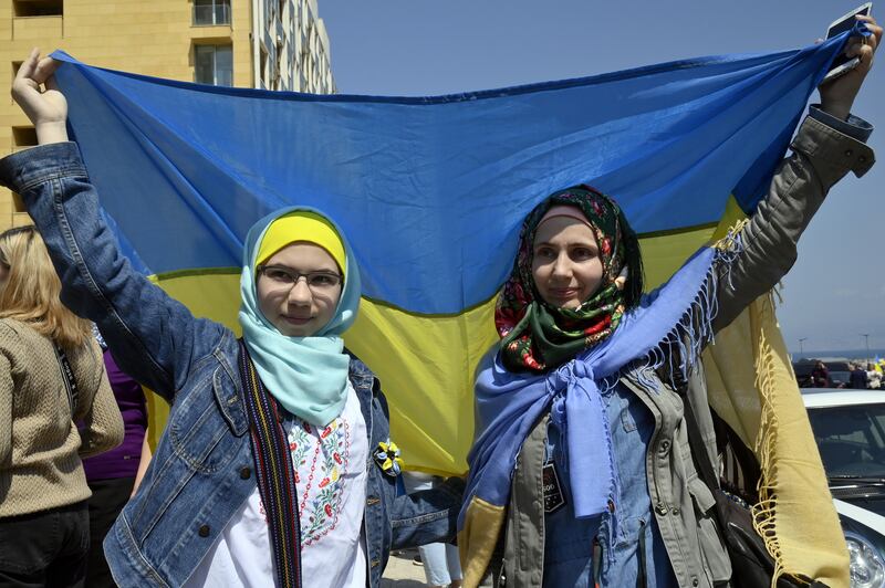 A Ukrainian flag being carried during a protest against the war in Ukraine and in support of peace in downtown Beirut, Lebanon, 27 March 2022. Although many in the West see Russia as the clear aggressor, there are more divergent views in the Middle East. EPA