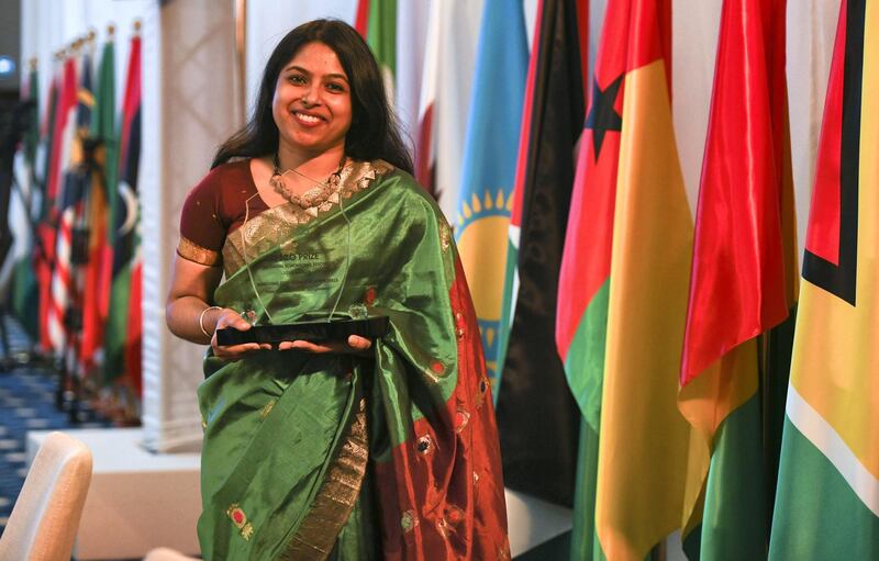 Abu Dhabi, United Arab Emirates - Sifa Haque, an English teacher from Bangladesh wins an award at the opening ceremony for the 40th Session of the Executive Council taking place in ADNEC. Khushnum Bhandari for The National