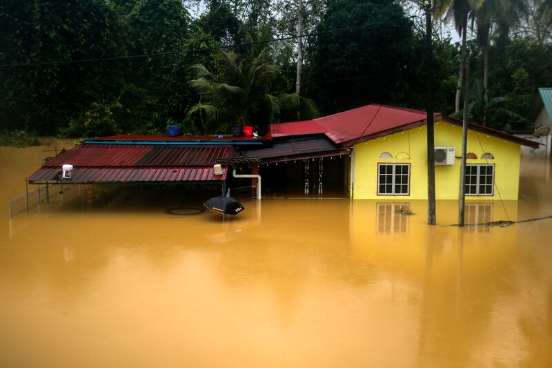 A flooded house after continuous rainfall in Segamat, in Malaysia.   EPA
