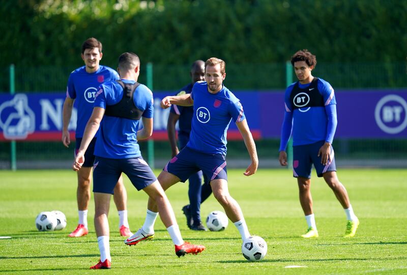 England captain Harry Kane, centre, during a training session at Hotspur Way training Ground, London on Tuesday September 7 ahead of the 2022 World Cup qualifying match against Poland. PA