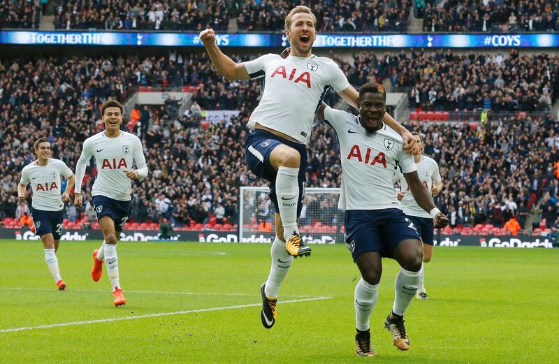 Tottenham's Harry Kane, center, celebrates after scoring his side's first goal during the English Premier League soccer match between Tottenham Hotspur and Liverpool at Wembley Stadium in London, Sunday, Oct. 22, 2017.Tottenham won by 4-1.(AP Photo/Frank Augstein)