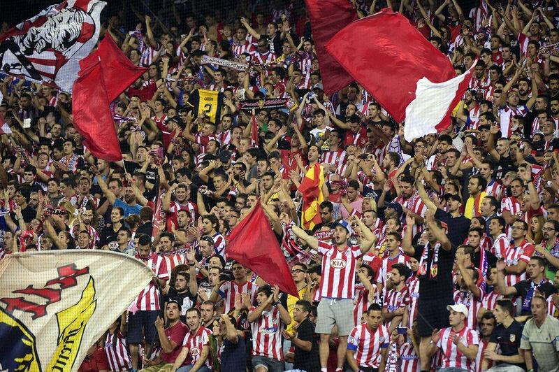 Atletico Madrid's fans celebrate after winning the Spanish Super Cup on Friday night.  Gerard Julien / AFP