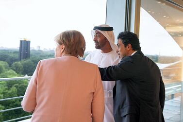 Sheikh Mohamed bin Zayed , Crown Prince of Abu Dhabi and Deputy Supreme Commander of the UAE Armed Forces, with German Chancellor Angela Merkel and Deputy Prime Minister and Minister of Presidential Affairs Sheikh Mansour bin Zayed before a dinner reception in Berlin. Mohamed Al Hammadi / Ministry of Presidential Affairs