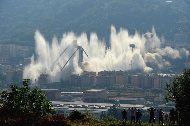 The pylons 10 and 11 of the collapsed Morandi viaduct are demolished with a controlled dynamite explosion.  Getty