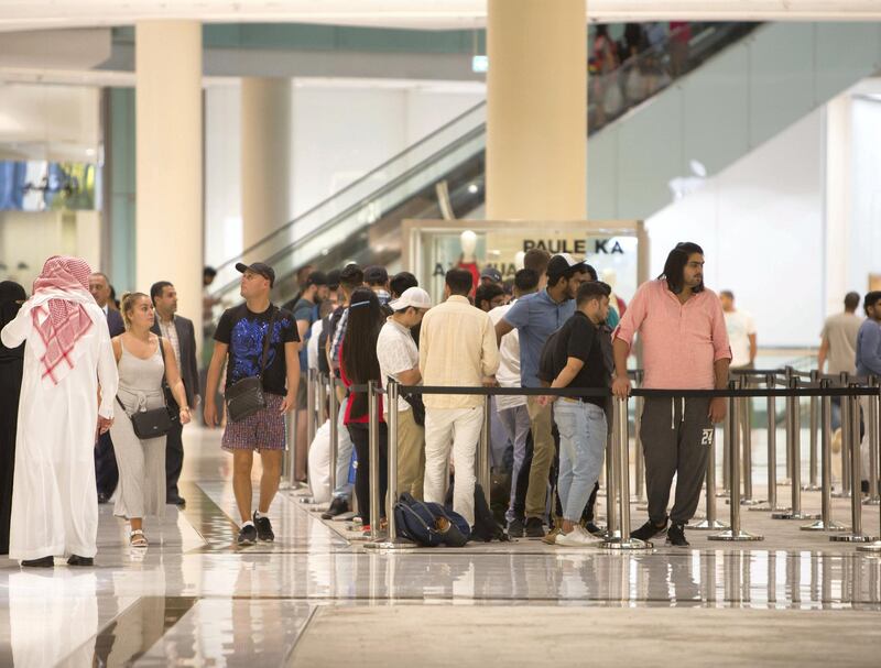 DUBAI, UNITED ARAB EMIRATES, 20 SEPTEMBER 2018 - Crowd waiting in queue to get the new iphone XS at Apple store in Dubai Mall.  Leslie Pableo for The National for Patrick Ryan’s story