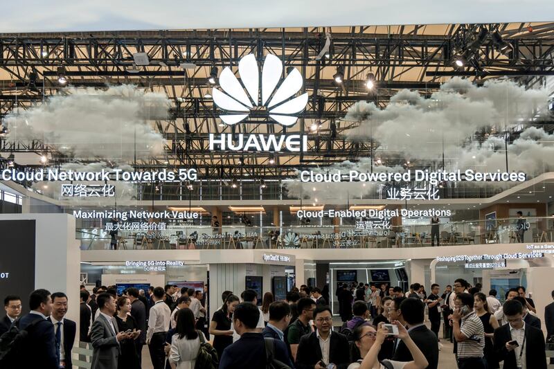 FILE PHOTO: Visitors are seen at a Huawei stand during the 2017 Mobile World Congress in Shanghai, China June 28, 2017. REUTERS/Stringer/File Photo ATTENTION EDITORS - THIS IMAGE WAS PROVIDED BY A THIRD PARTY. CHINA OUT