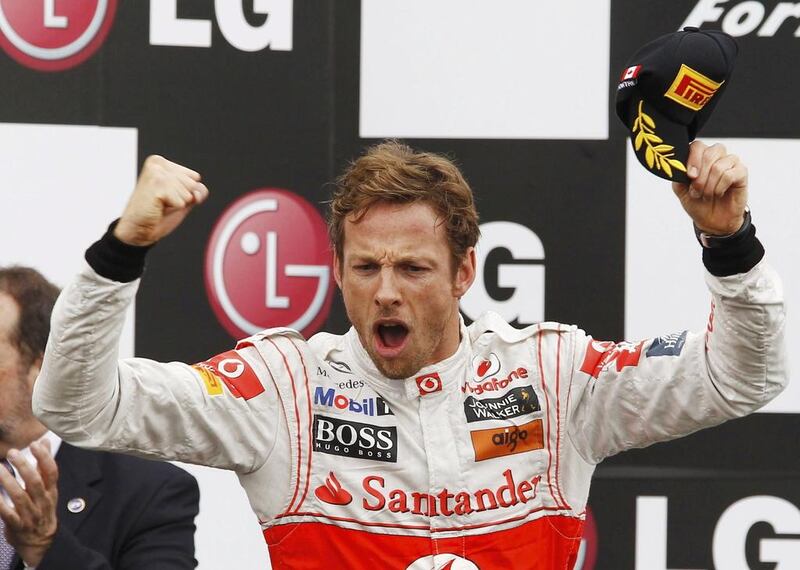 Jenson Button celebrates on the podium after his victory at the 2011 Canadian Grand Prix. Chris Wattie / Reuters