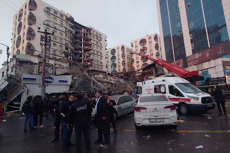 Several buildings collapsed, trapping many people underneath the rubble. AP