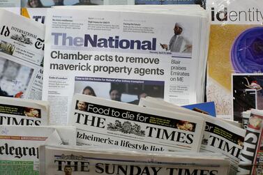 The first edition of The National newspaper sits in the stands in Abu Dhabi. Andrew Parsons / The National