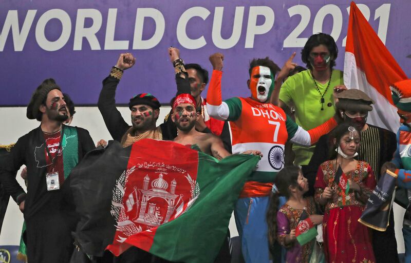 Indian and Afghan cricket fans cheer for their teams during the T20 World Cup match. AP