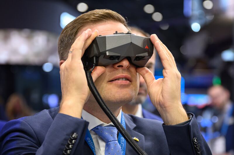 Estonian Defence Minister Hanno Pevkur tries the Vegvisir Core mixed reality situational awareness system at the Estonia Pavilion. Getty Images