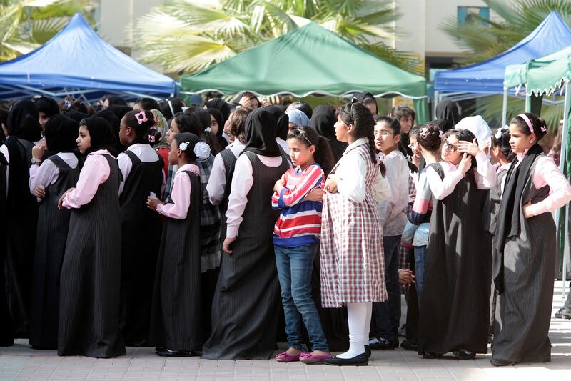 Dubai, United Arab Emirates - September 8, 2013.  Students from grade 6 to 9 were assembled to start their program, to sing their national anthem, hear their principal's welcoming remarks and some raffle draws.  First day of school in Nadd Al Hamar Primary School for Basic Education Cycle 2.  ( Jeffrey E Biteng / The National )   *** Local Caption ***  JB080913-Publicschool09.jpg