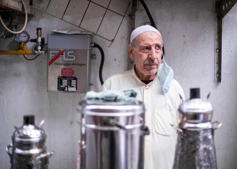 DUBAI, UNITED ARAB EMIRATES.  7 FEBRUARY 2021. 
Hussain Al Khawali runs his coffee stall in Al Sabkha. 
He's been in the same neighborhood, serving coffee to the community, for 40 years. 
Photo: Reem Mohammed / The National
Reporter: